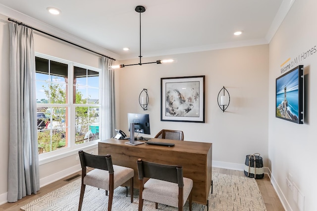 office space featuring baseboards, visible vents, light wood-style floors, and recessed lighting