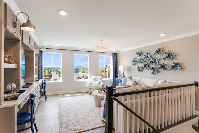 bedroom with baseboards, light wood finished floors, crown molding, and multiple windows
