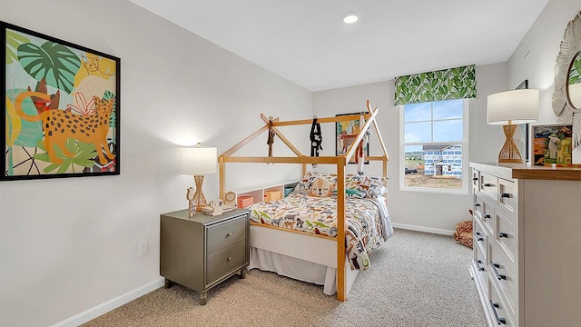 bedroom featuring baseboards, recessed lighting, and light carpet