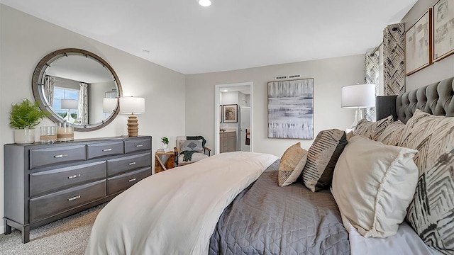 bedroom featuring ensuite bath