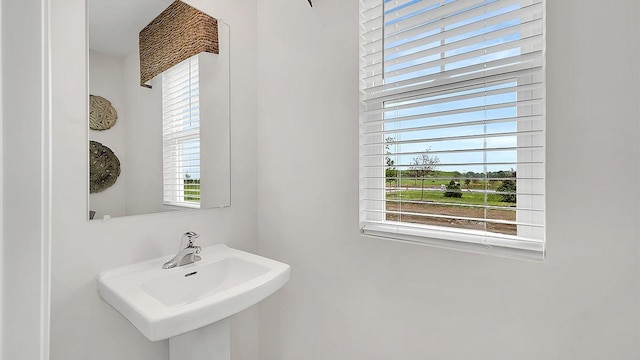 bathroom with a sink and plenty of natural light