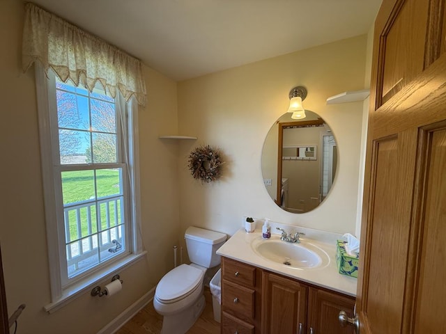 17N975 Harmony Rd, Hampshire, IL 60140 - half bathroom with vanity, toilet, wood finished floors, and a wealth of natural light