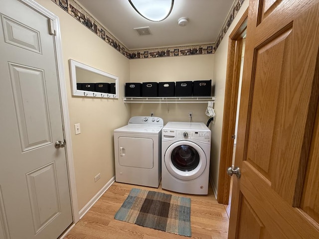 17N975 Harmony Rd, Hampshire, IL 60140 - laundry area featuring laundry area, light wood-style floors, baseboards, and separate washer and dryer