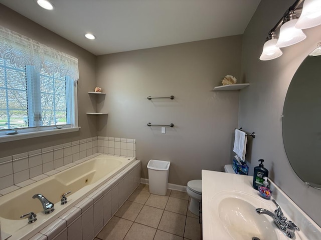 17N975 Harmony Rd, Hampshire, IL 60140 - full bath featuring a sink, tile patterned flooring, toilet, a whirlpool tub, and baseboards