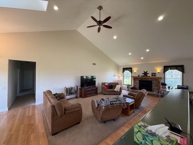17N975 Harmony Rd, Hampshire, IL 60140 - living area featuring light wood-style floors, ceiling fan, high vaulted ceiling, and a fireplace