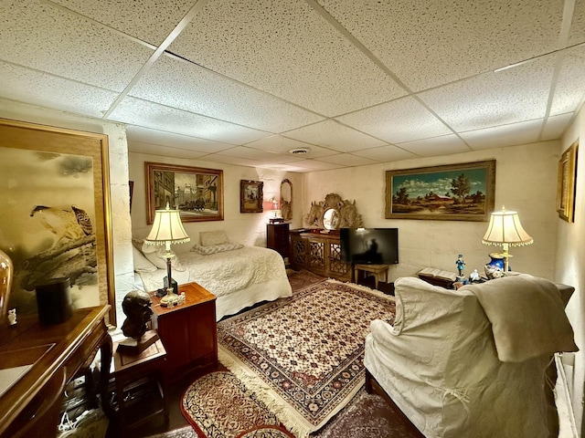 bedroom featuring a paneled ceiling
