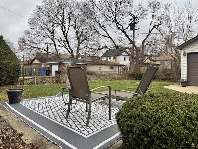 view of patio / terrace featuring fence and a residential view