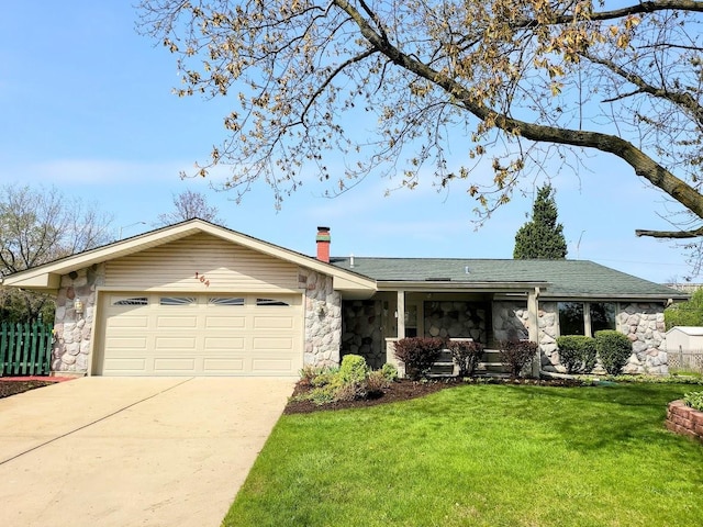 ranch-style house featuring stone siding, a garage, a front yard, a chimney, and driveway