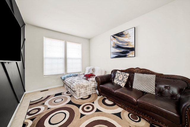 living room with baseboards and carpet flooring