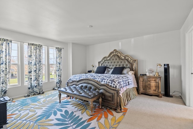 bedroom with carpet and baseboards