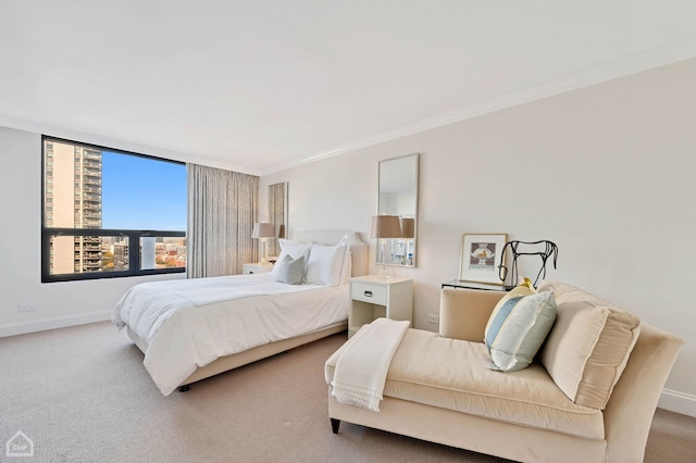 bedroom with crown molding, carpet, and baseboards