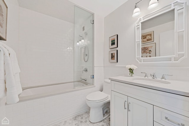 bathroom featuring vanity, shower / bathtub combination, and toilet