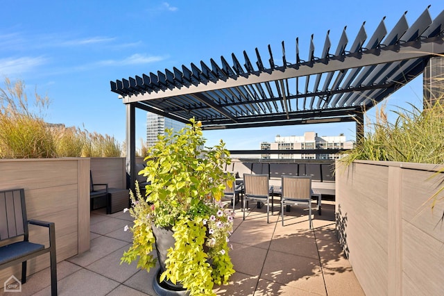 view of patio featuring a pergola and outdoor dining area