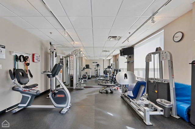 gym with a drop ceiling and visible vents