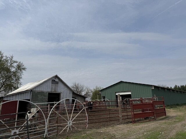 view of street featuring an exterior structure and a rural view