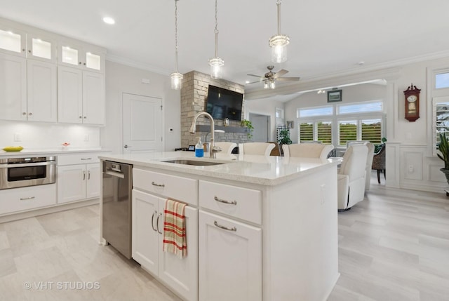 13 Briden Ln Unit 13, Sycamore, IL 60178 - kitchen with a sink, appliances with stainless steel finishes, crown molding, a ceiling fan, and decorative light fixtures