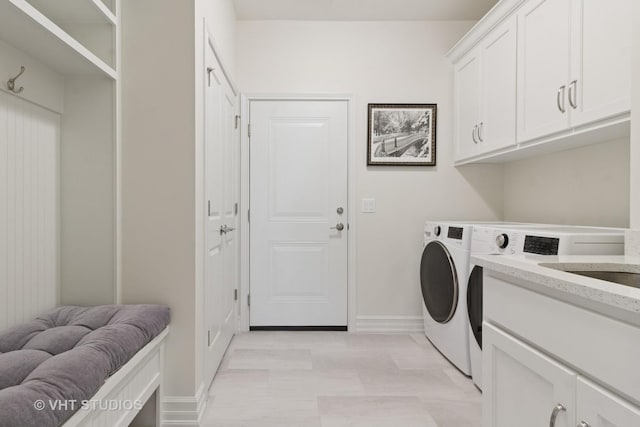 13 Briden Ln Unit 13, Sycamore, IL 60178 - washroom featuring separate washer and dryer, cabinet space, and baseboards