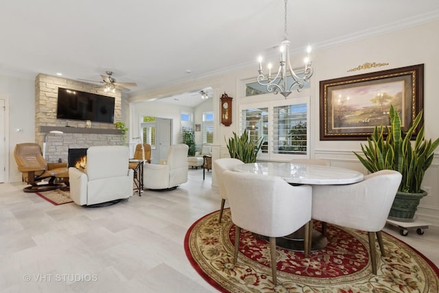 13 Briden Ln Unit 13, Sycamore, IL 60178 - dining area with ceiling fan, ornamental molding, a stone fireplace, healthy amount of natural light, and a chandelier