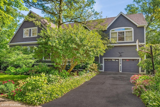 475 Maple St, Winnetka, IL 60093 - shingle-style home featuring a garage, asphalt driveway, and a shingled roof