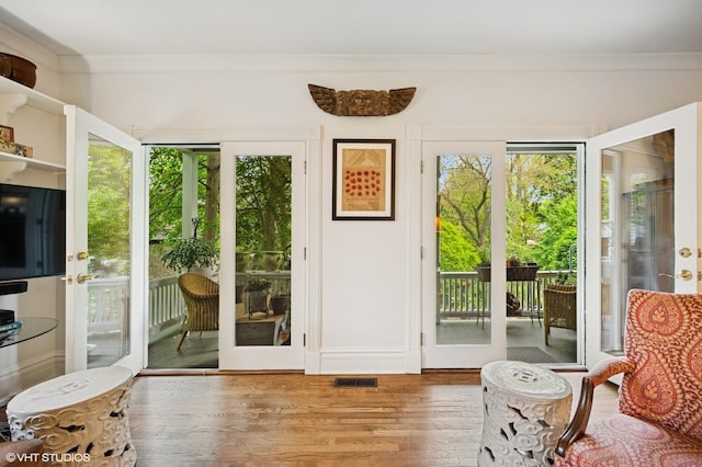 475 Maple St, Winnetka, IL 60093 - entryway featuring crown molding, wood finished floors, and plenty of natural light