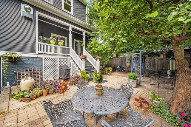 475 Maple St, Winnetka, IL 60093 - fenced backyard featuring stairway, a patio, grilling area, and outdoor dining space