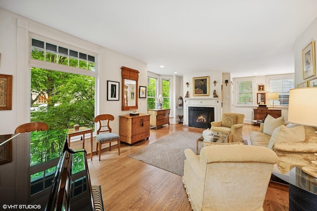 475 Maple St, Winnetka, IL 60093 - living room featuring a fireplace with flush hearth, light wood-style floors, and recessed lighting