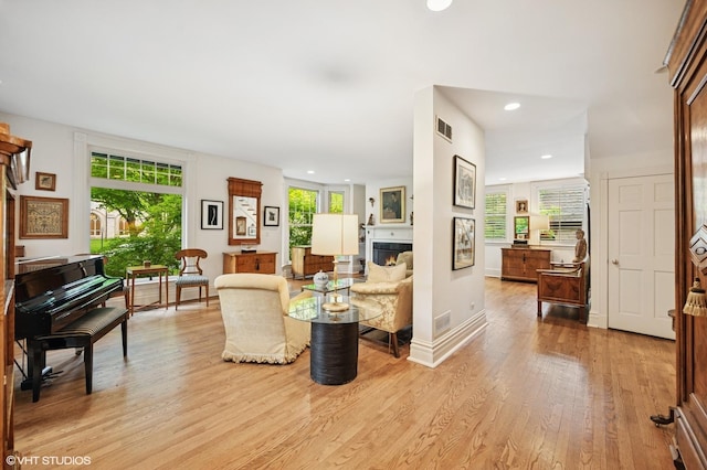 475 Maple St, Winnetka, IL 60093 - living room featuring light wood-style floors, recessed lighting, and a warm lit fireplace