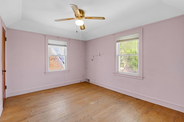 3134 N Mason Ave, Chicago, IL 60634 - spare room featuring healthy amount of natural light, light wood finished floors, a ceiling fan, baseboards, and vaulted ceiling