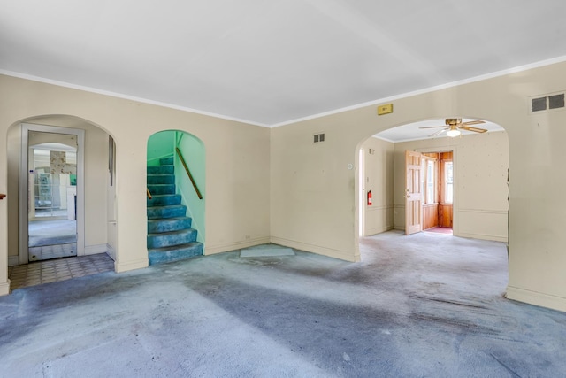 3134 N Mason Ave, Chicago, IL 60634 - unfurnished room with crown molding, a ceiling fan, arched walkways, carpet floors, and baseboards