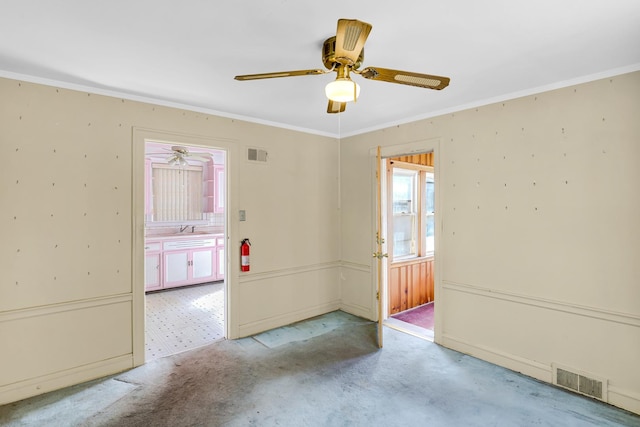 3134 N Mason Ave, Chicago, IL 60634 - carpeted empty room featuring ceiling fan, ornamental molding, and a sink