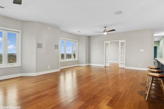 1 Renaissance Pl Unit 1Ph, Palatine, IL 60067 - unfurnished living room featuring ceiling fan, french doors, and plenty of natural light