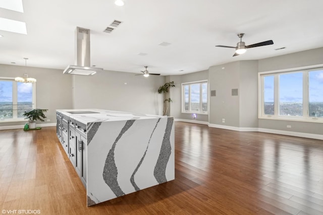 1 Renaissance Pl Unit 1Ph, Palatine, IL 60067 - corridor with wood finished floors, baseboards, a skylight, and a chandelier