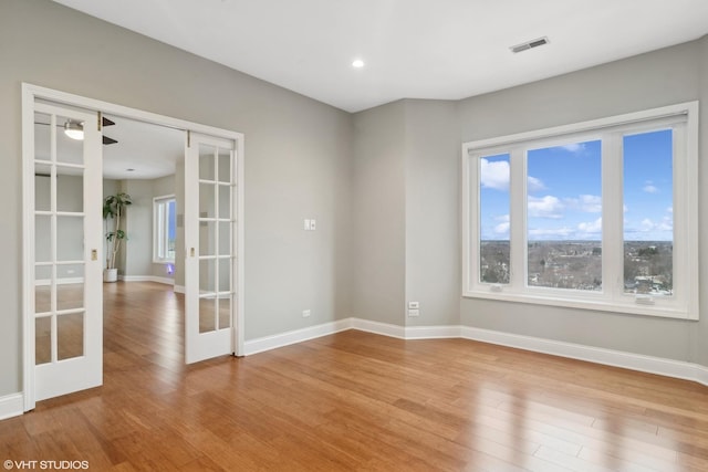 1 Renaissance Pl Unit 1Ph, Palatine, IL 60067 - empty room featuring french doors, wood finished floors, baseboards, and recessed lighting