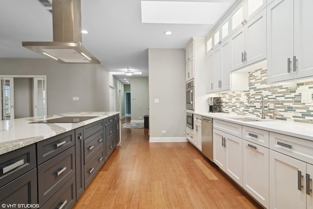 1 Renaissance Pl Unit 1Ph, Palatine, IL 60067 - kitchen with a sink, stainless steel appliances, island exhaust hood, white cabinets, and tasteful backsplash