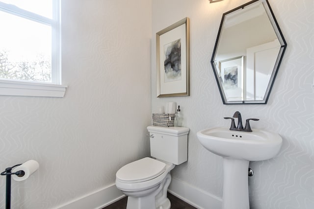 4 Olympia Fields Ct, Hawthorn Woods, IL 60047 - half bath featuring a healthy amount of sunlight, toilet, and baseboards