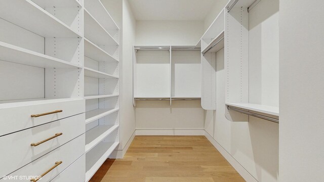 spacious closet featuring light wood-type flooring