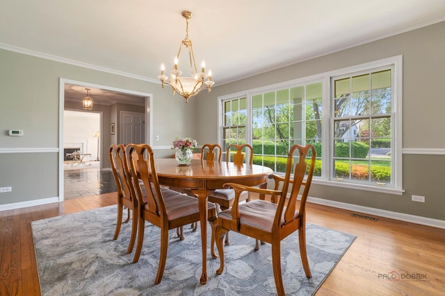 1878 Hackberry Ln, Lake Forest, IL 60045 - dining room with a chandelier, baseboards, ornamental molding, and wood finished floors