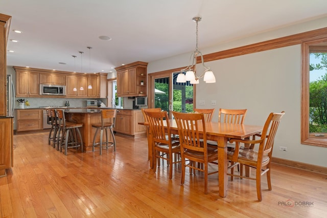 1878 Hackberry Ln, Lake Forest, IL 60045 - dining area with light wood-style flooring, recessed lighting, baseboards, and a chandelier