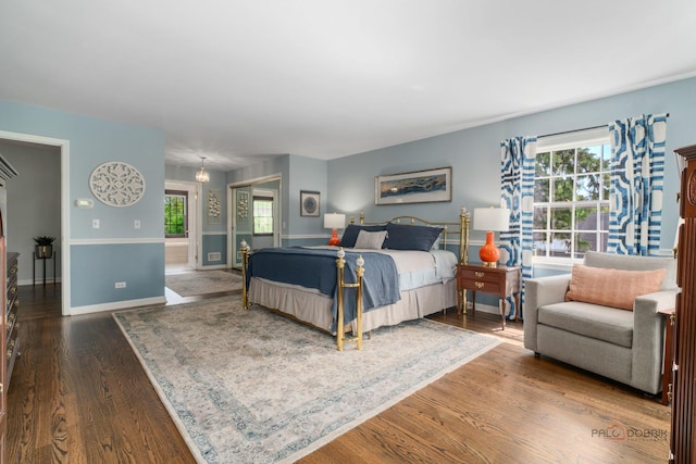 1878 Hackberry Ln, Lake Forest, IL 60045 - bedroom with multiple windows, wood finished floors, and baseboards