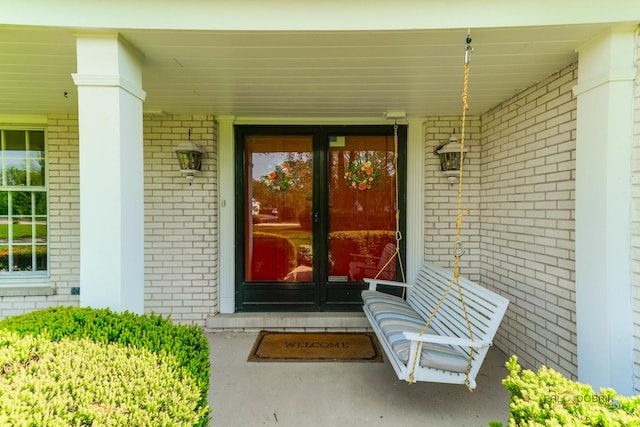 1878 Hackberry Ln, Lake Forest, IL 60045 - entrance to property with brick siding, covered porch, and french doors