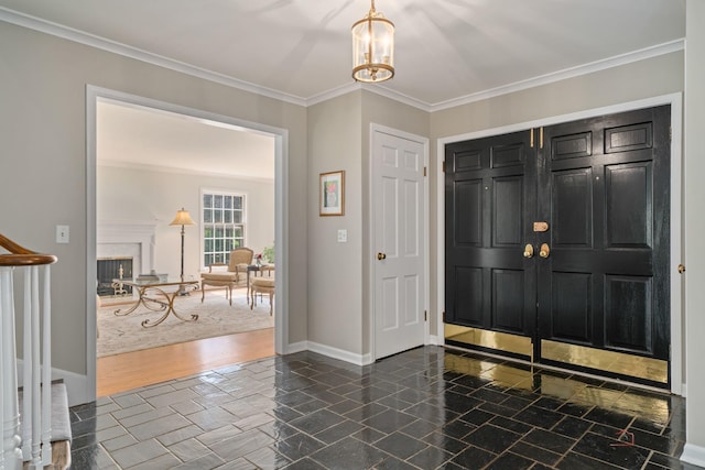 1878 Hackberry Ln, Lake Forest, IL 60045 - entryway featuring crown molding, baseboards, and a fireplace
