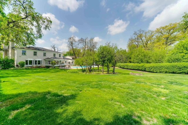 1878 Hackberry Ln, Lake Forest, IL 60045 - view of green lawn with an outdoor pool
