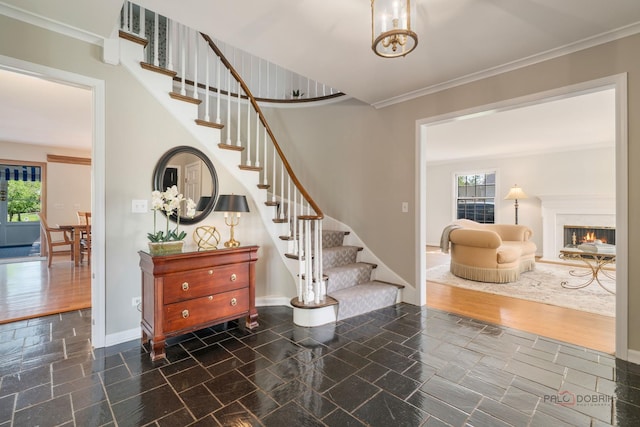 1878 Hackberry Ln, Lake Forest, IL 60045 - stairway featuring plenty of natural light, baseboards, a warm lit fireplace, crown molding, and stone finish flooring