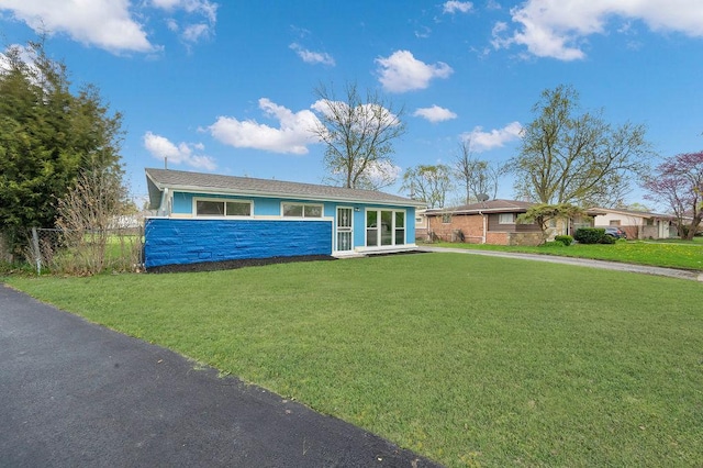 1401 Stanley Blvd, Calumet City, IL 60409 - ranch-style home featuring fence, stone siding, and a front yard