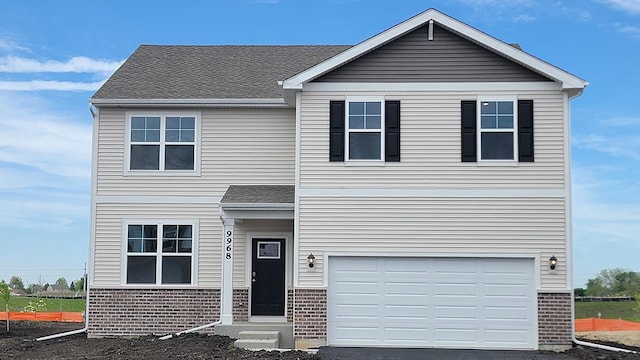 9968 Central Park Blvd, Huntley, IL 60142 - view of front of property featuring brick siding, a garage, and driveway