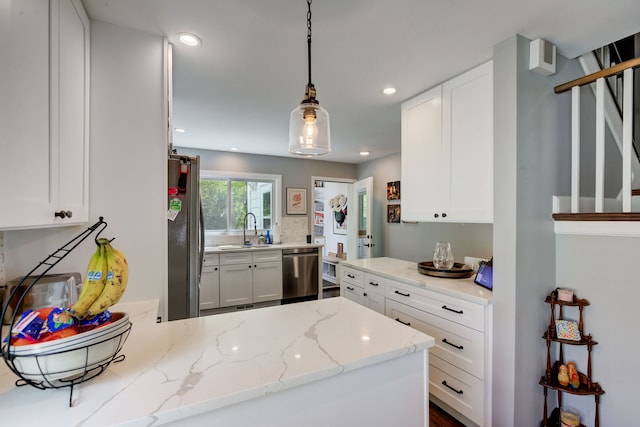 627 Beaver Rd, Glenview, IL 60025 - kitchen with white cabinetry, appliances with stainless steel finishes, a sink, and recessed lighting