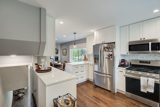 627 Beaver Rd, Glenview, IL 60025 - kitchen with a peninsula, appliances with stainless steel finishes, and white cabinetry