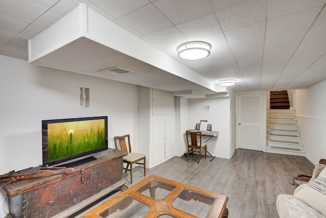 627 Beaver Rd, Glenview, IL 60025 - living room with visible vents, stairs, and wood finished floors