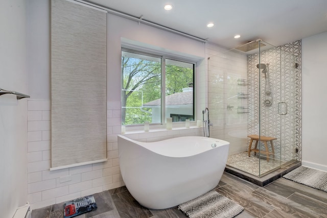 627 Beaver Rd, Glenview, IL 60025 - full bath featuring tile walls, a soaking tub, a shower stall, and recessed lighting