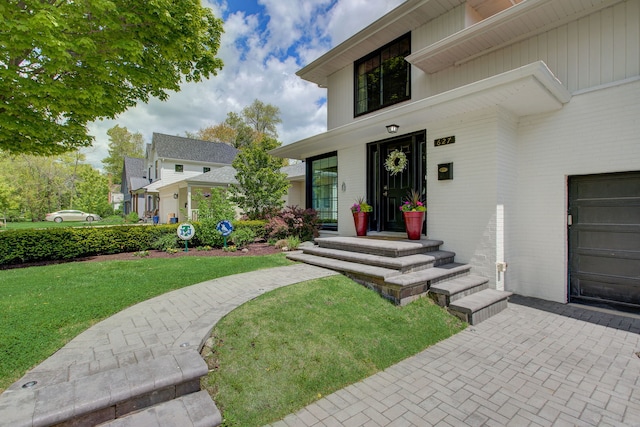 627 Beaver Rd, Glenview, IL 60025 - entrance to property featuring a lawn and brick siding